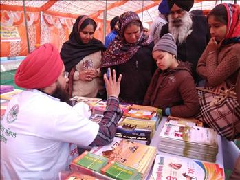 S. Simranjit Singh, explaining Atam Pargas Publications to the visitors.