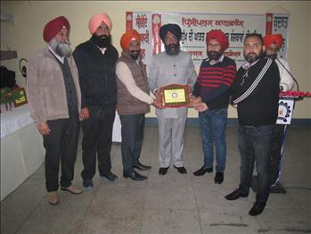 Dr. Varinderpal Singh being honored by the college authorities.