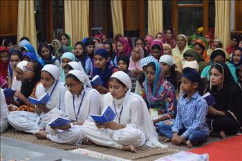 The delegates reciting the Rehras Sahib collectively in the Sangat form