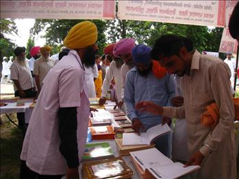Farmers showing keen interest in Atam Pargas play way books.