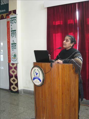 Pr. Gurmant Kaur addressing the gathered faculty
