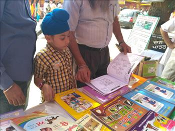 Young visitors and children were happy to buy books.