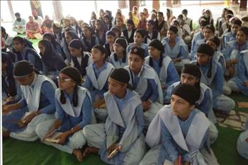 Students listening attentively to the orator. 