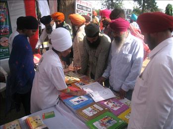 Visitors engrossed in the attractive Atam Pargas Publications.