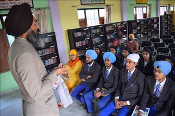 Dr. Varinderpal Singh, Senior Soil Scientist, PAU discussing the Atam Pargas timetable with Positive thinkers
