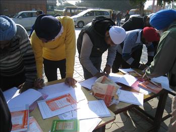 Participants marking their attendance during registration