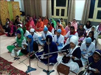 Delegates reciting the Nitname collectively in the Sangat form