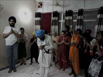 Sangat performed Ardass before Guru Granth Sahib ji for blessings .